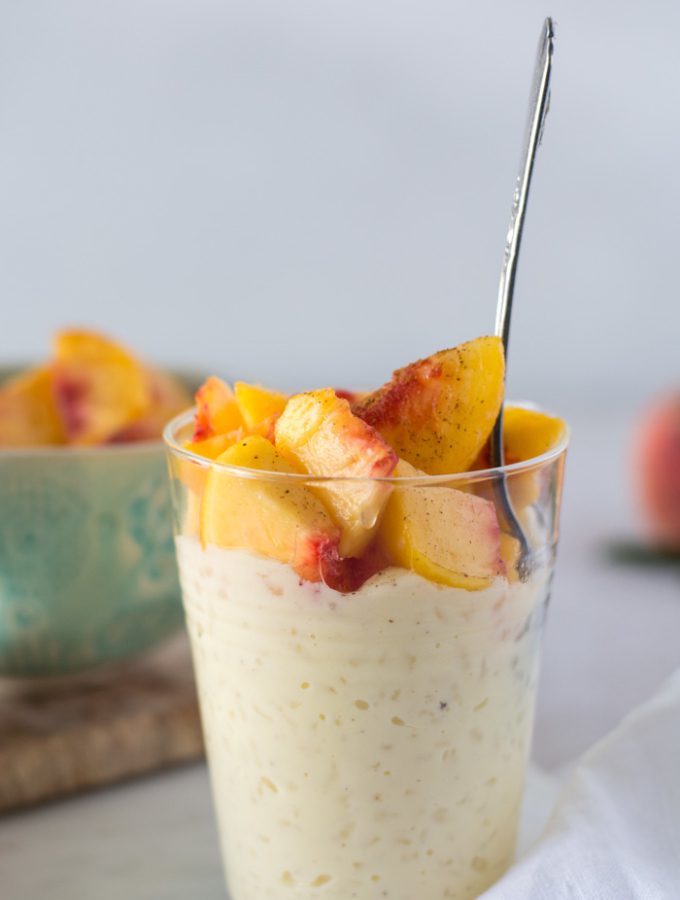 Simple Rice Pudding and Peaches glass cup with rice pudding peaches on top