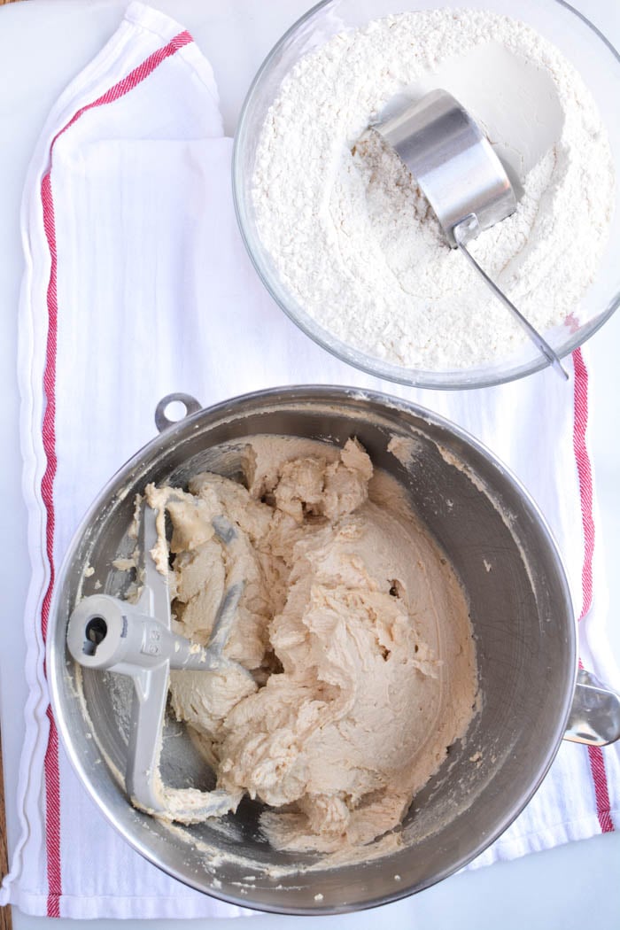 Flour being added to jumbo chocolate chip cookies batter