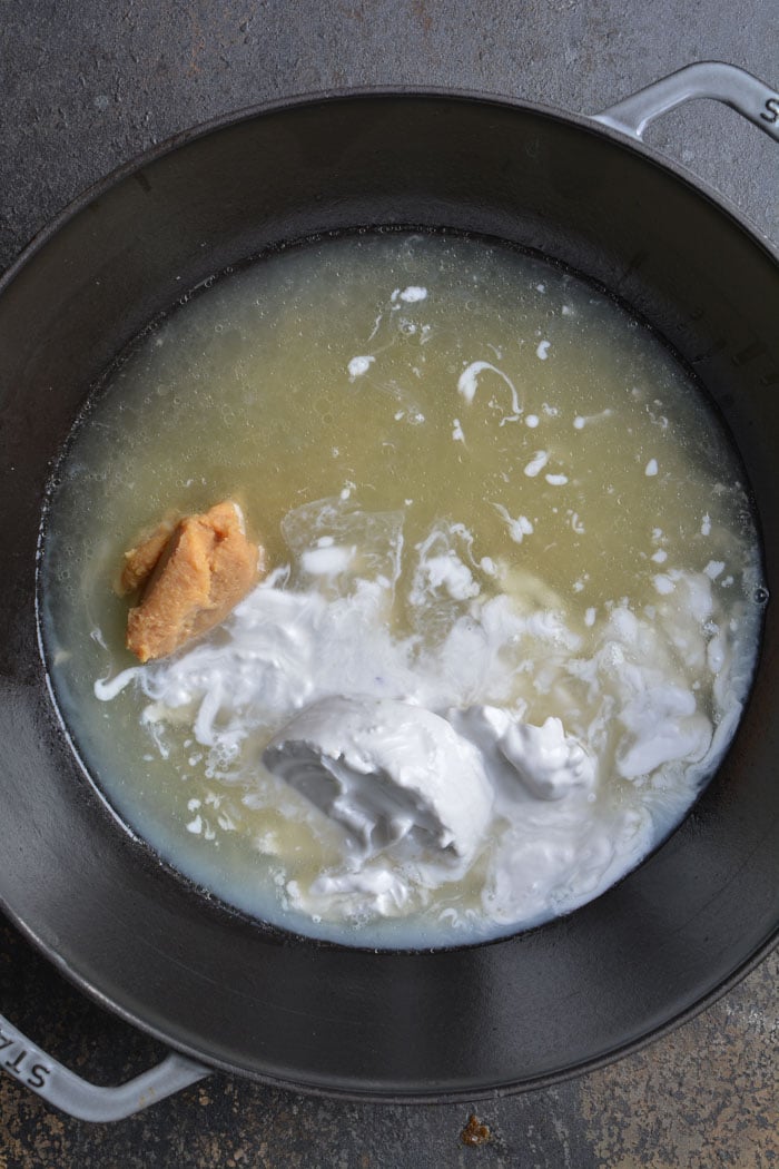 broth and coconut milk miso in pan