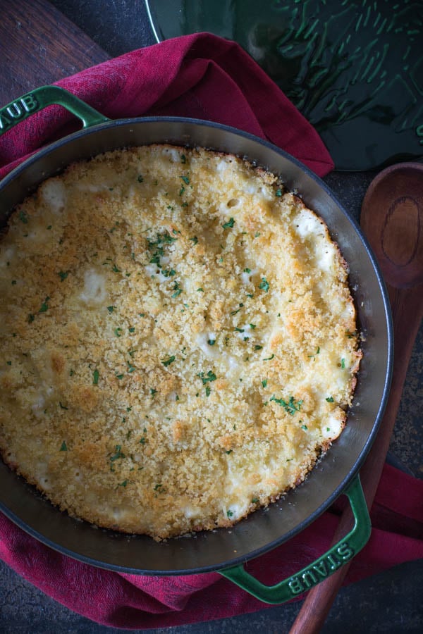 close up of pot with macaroni and cheese red napkin