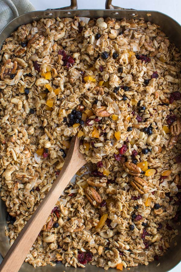 granola, wooden spoon