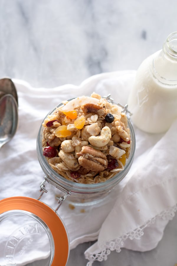 granola in glass jar bottle of milk