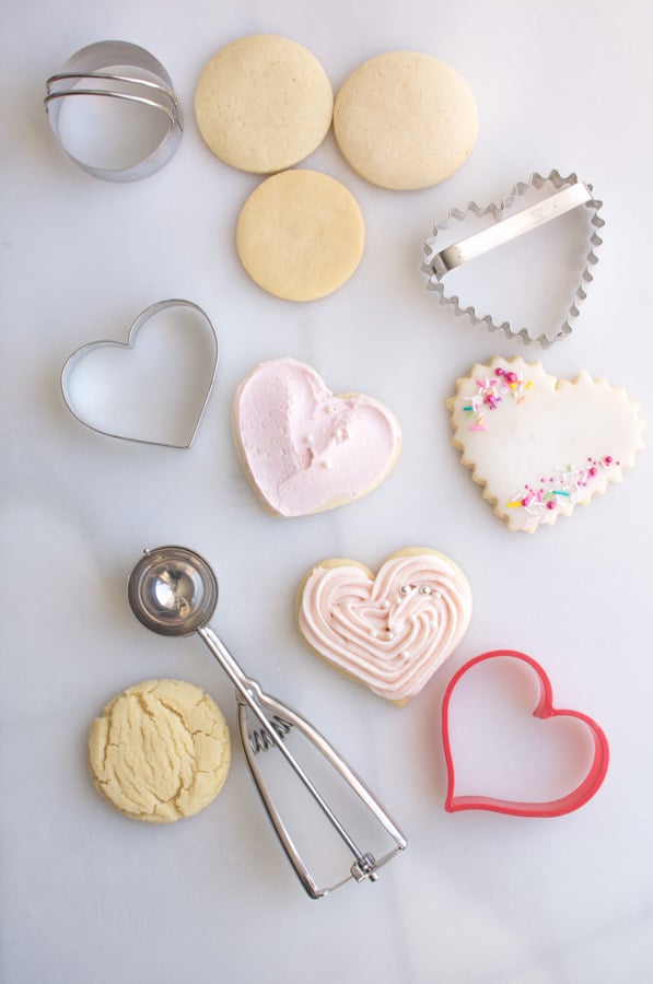 assortment of sugar cookies and cutters