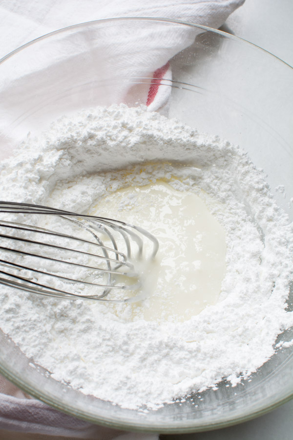 Wire whisk mixing icing ingredients