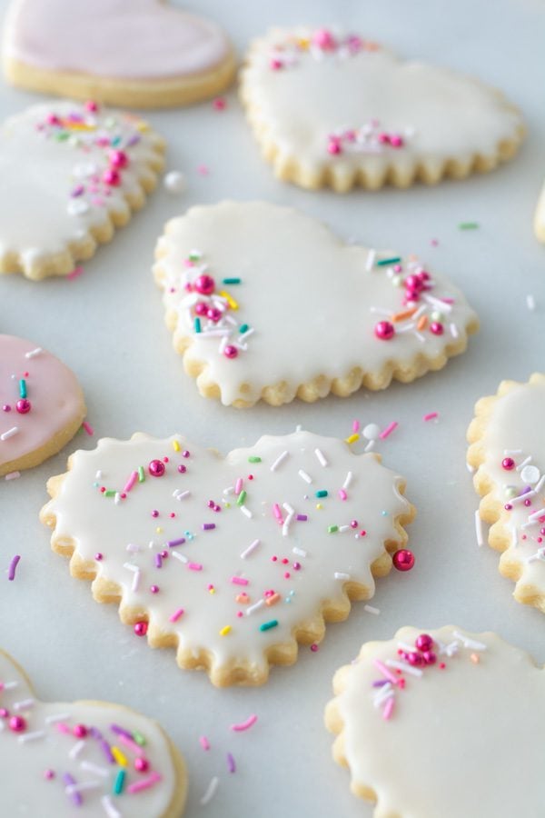 assortment of sprinkles on heart shape sugar cookies