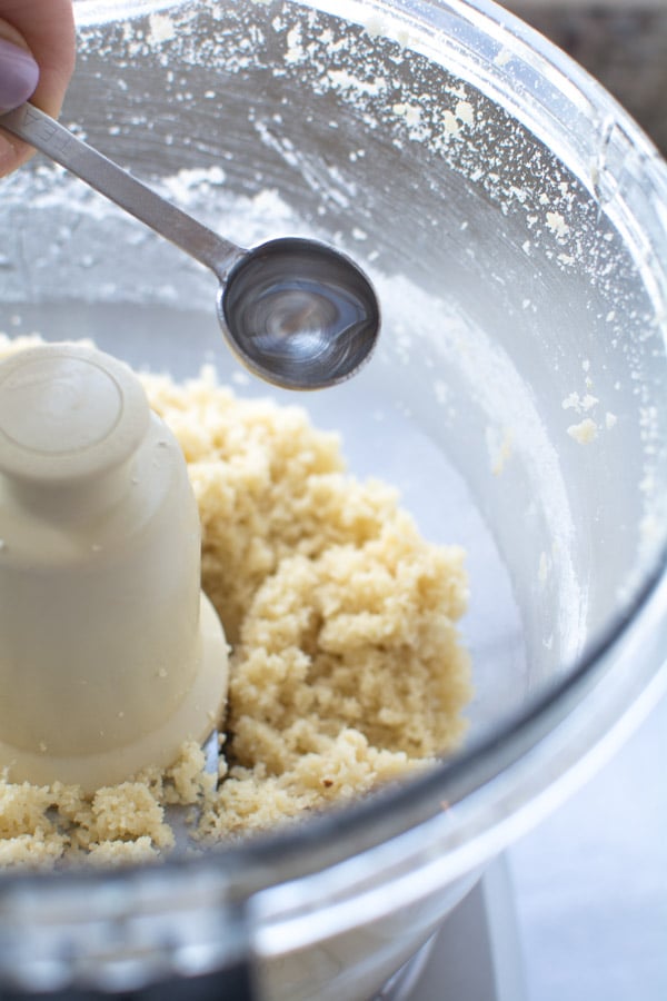 Ground almonds and powdered sugar with teaspoon water