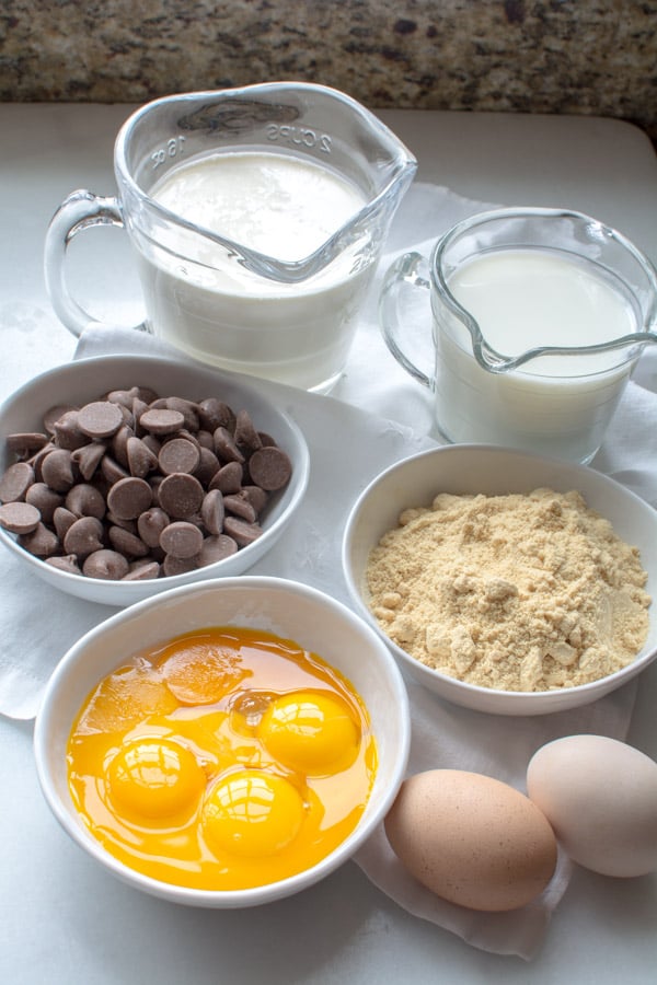 bowls with eggs, malted milk powder, chocolate, cream