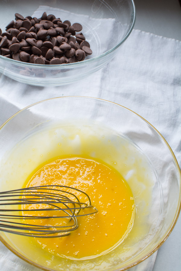 bowl with chocolate chips, bowl with egg yolks