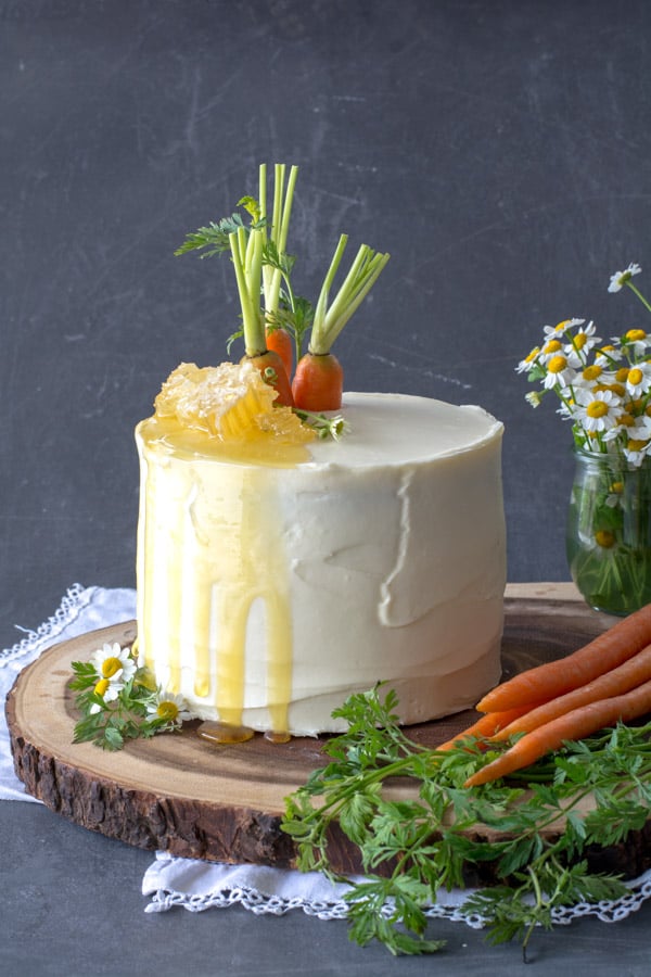 Carrot cake on wood with honey comb