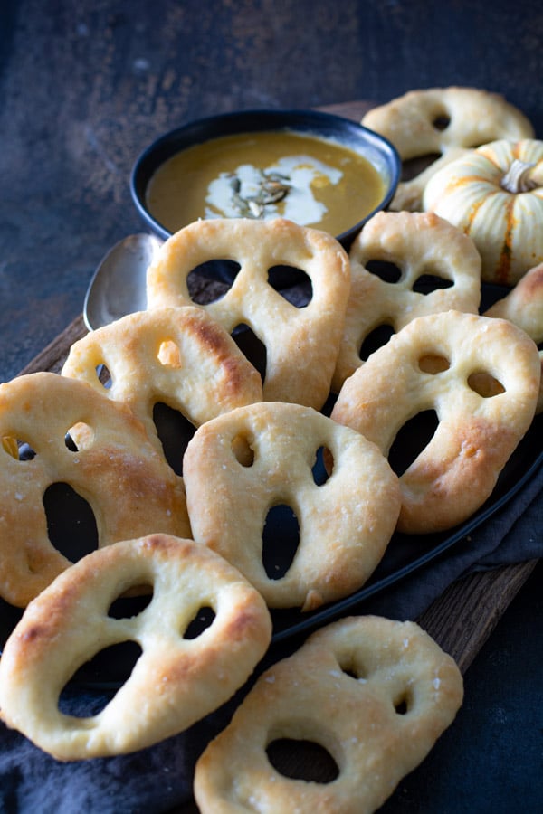 baked ghost fougasse on black platter