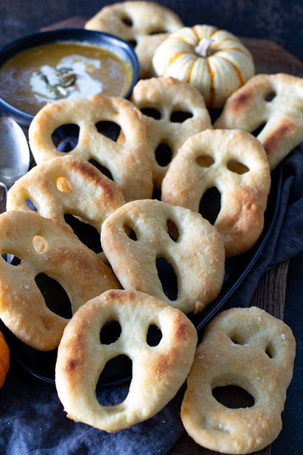 several ghost fougasse on black platter