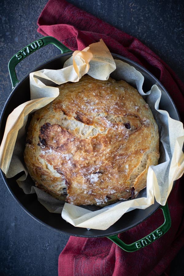 Overhead shot of bread in pot lined with parchment