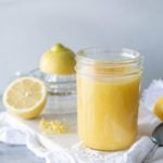 jar of lemon curd on white cloth