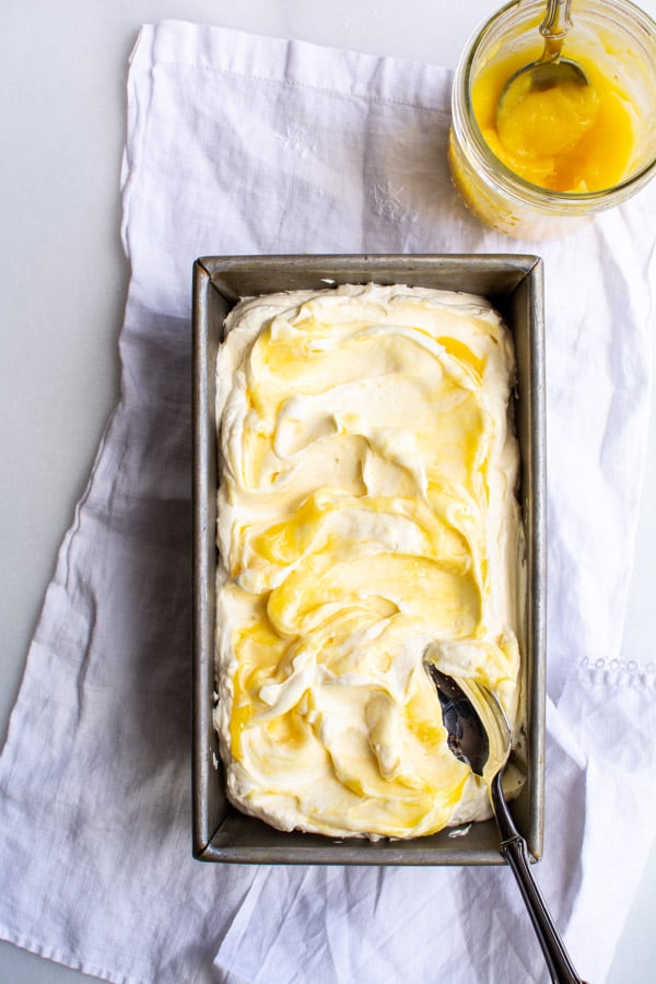 Lemon curd swirled into whipped no churn lemon curd ice cream