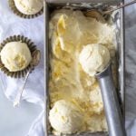 pan of frozen lemon curd ice cream with ice cream scoop