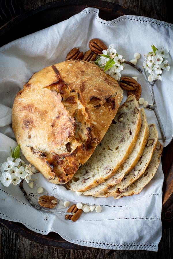 Overhead shot of white chocolate pecan bread with 4 slices