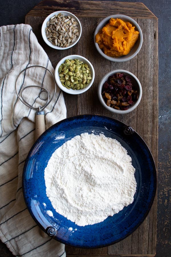 Overhead shot of a blue bowl filled with flour.