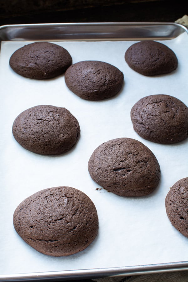 Chocolate cookies on a baking sheet baked