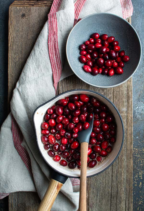 saucepan and bowl filled with cranberries