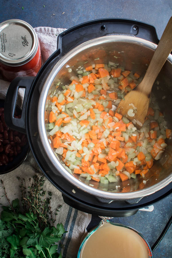 Onions, carrots, celery in a pot sauteed