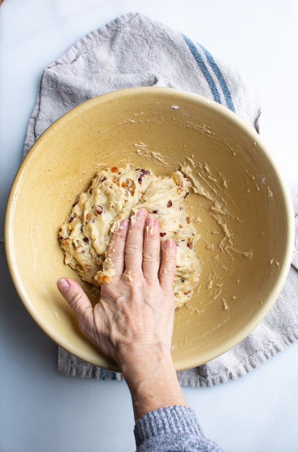 Stollen dough with hand folding dough into center