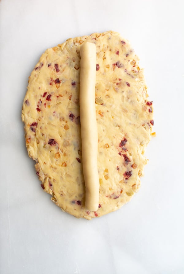 Rolled out Stollen dough with log of marzipan in the center