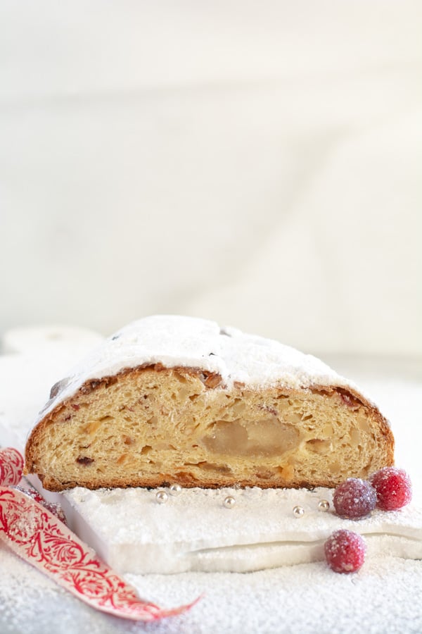 Baked stollen cut in half showing ribbon of marzipan