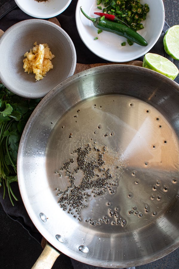 Sautee pan with garlic and mustard seeds