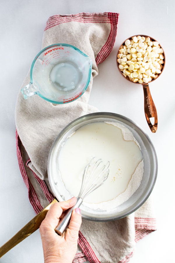 Saucepan with flour sugar mixture and milk