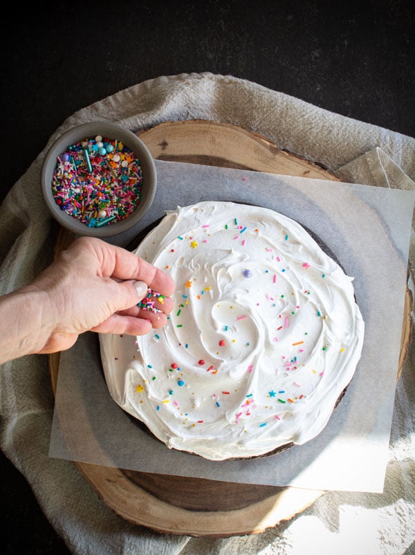 Boiled icing on chocolate cake with sprinkles on top