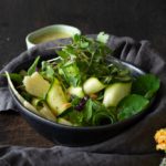 Bowl of Fresh Zucchini salad with microgreens