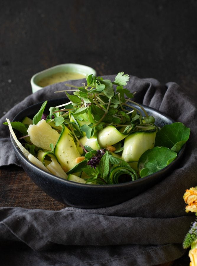 Bowl of Fresh Zucchini salad with microgreens