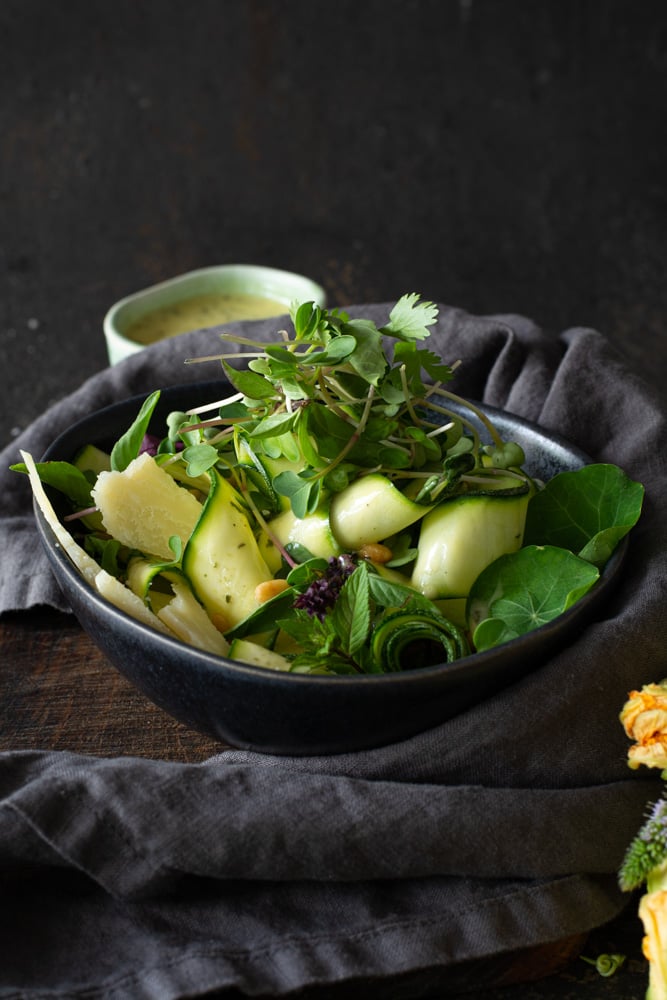 Bowl of Fresh Zucchini salad with microgreens