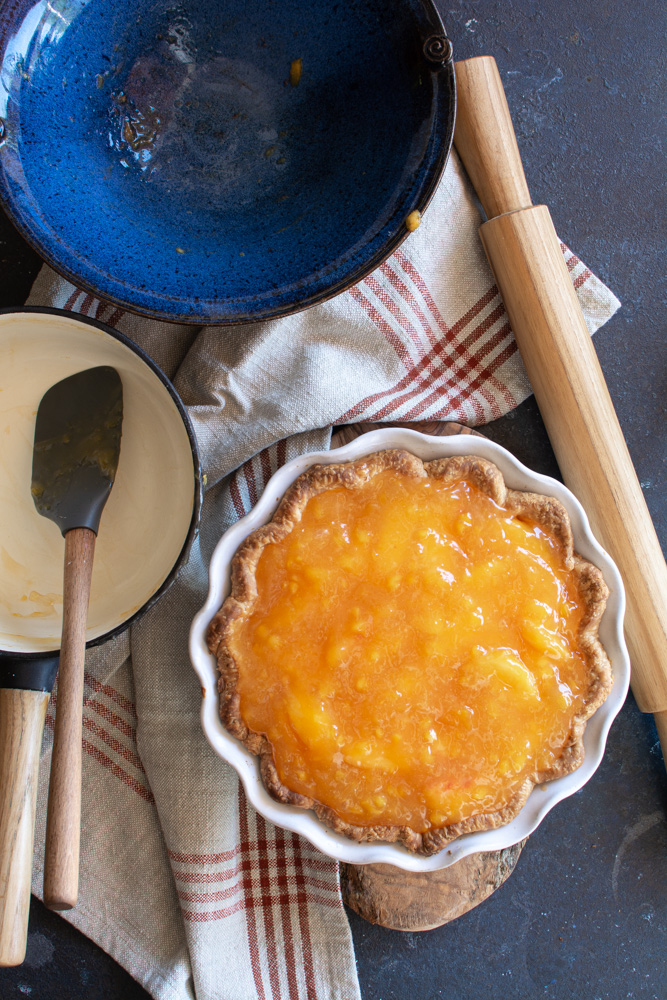 Fresh peach pie topped with peach glaze.