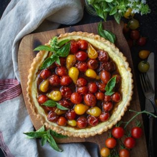 Baked ricotta tart topped with jammy cherry tomatoes
