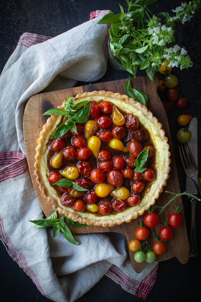 Baked ricotta tart topped with jammy cherry tomatoes