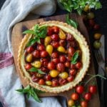 Baked ricotta tart topped with jammy cherry tomatoes