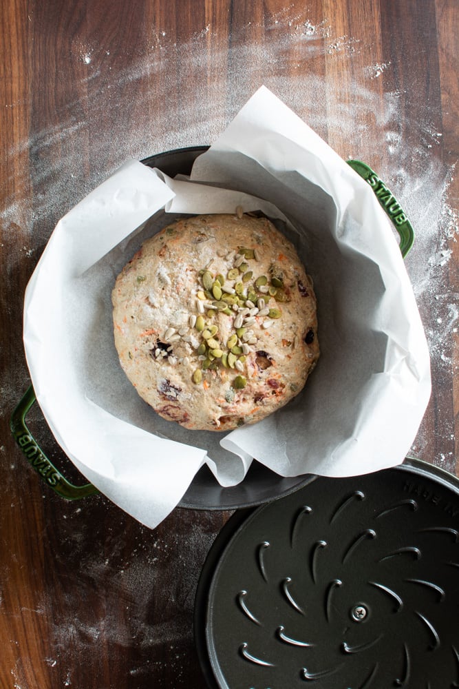 Breakfast bread on parchment paper in a large pot for baking
