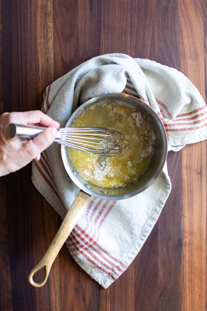 Butter and flour in a small saucepan stirred with a whisk for chicken Pot Pie