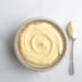 Velvety Vanilla pastry cream in a bowl with a spoon