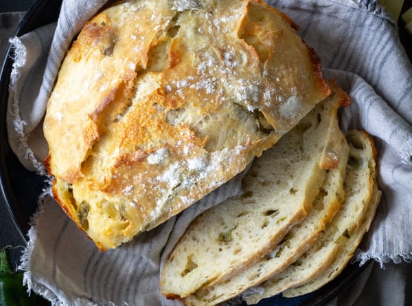 Slices of No-knead Partially sliced Green Chile Cheddar Bread