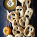 Ghost shaped fougasse on a black platter and wood background