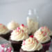 Chocolate cupcakes iced with fluffiest white chocolate icing with valentine sprinkles