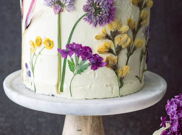 pressed flowers decorate lemon olive oil cake